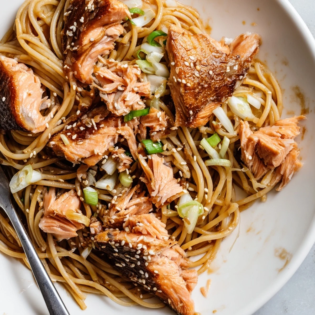 Delicious Japanese pan-fried salmon pasta, bursting with savory flavors and textures.  