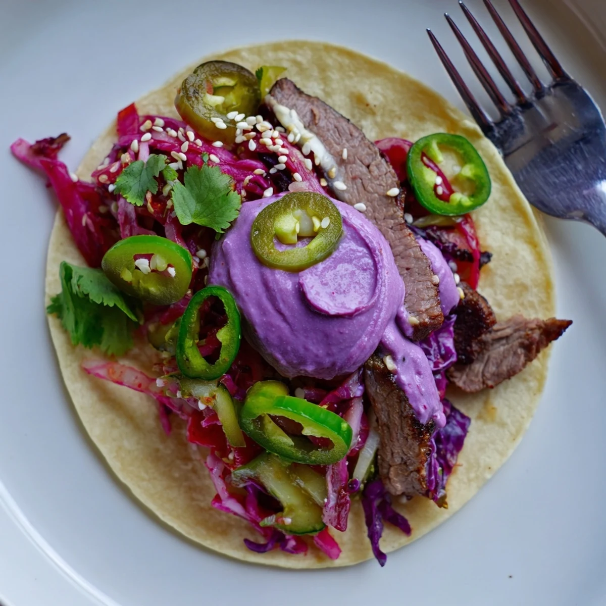 Colorful Global Street-Food Fusion Tacos showcasing tender meat, creamy ube, and pickled onions.