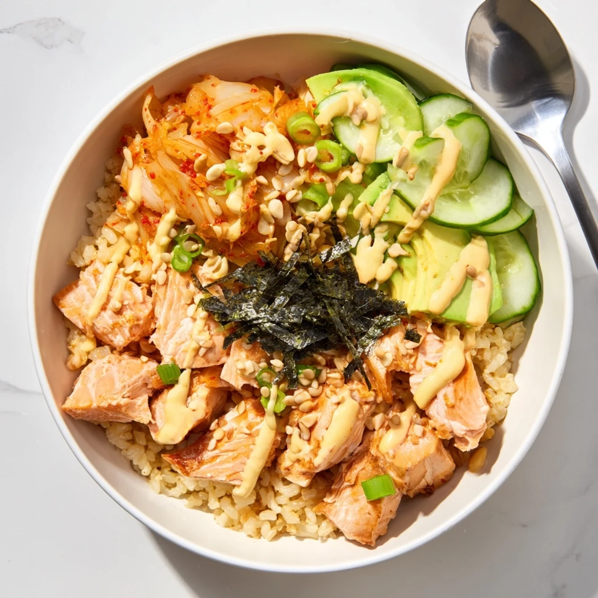 Crispy Salmon Rice Bowl featuring golden fish atop fluffy rice and vibrant toppings.  