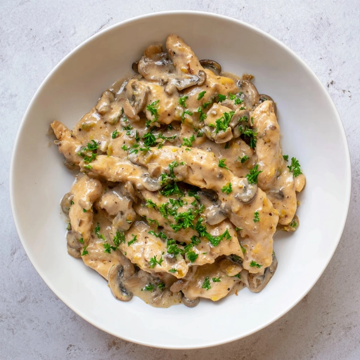 Golden, tender chicken pieces submerged in creamy mushroom sauce; this Creamy Chicken Stroganoff is comforting.