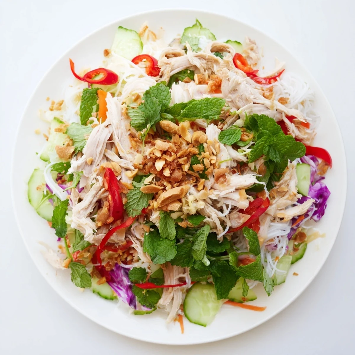Steaming shredded chicken and vibrant vegetables compose this Vietnamese Crunch Noodle Salad.