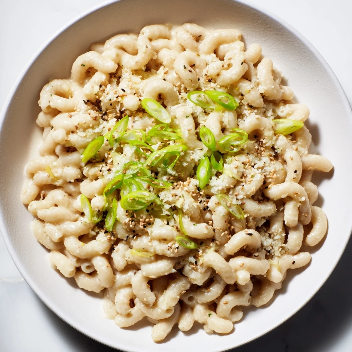 Creamy Japanese-inspired Miso Ditalini, glistening with sesame seeds and scallions, ready to be enjoyed.