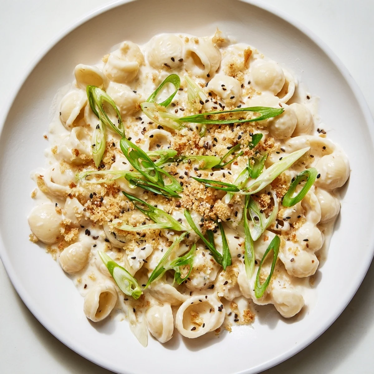 A steaming bowl of Creamy Miso Ditalini, showcasing tender pasta coated in a rich, savory miso sauce.