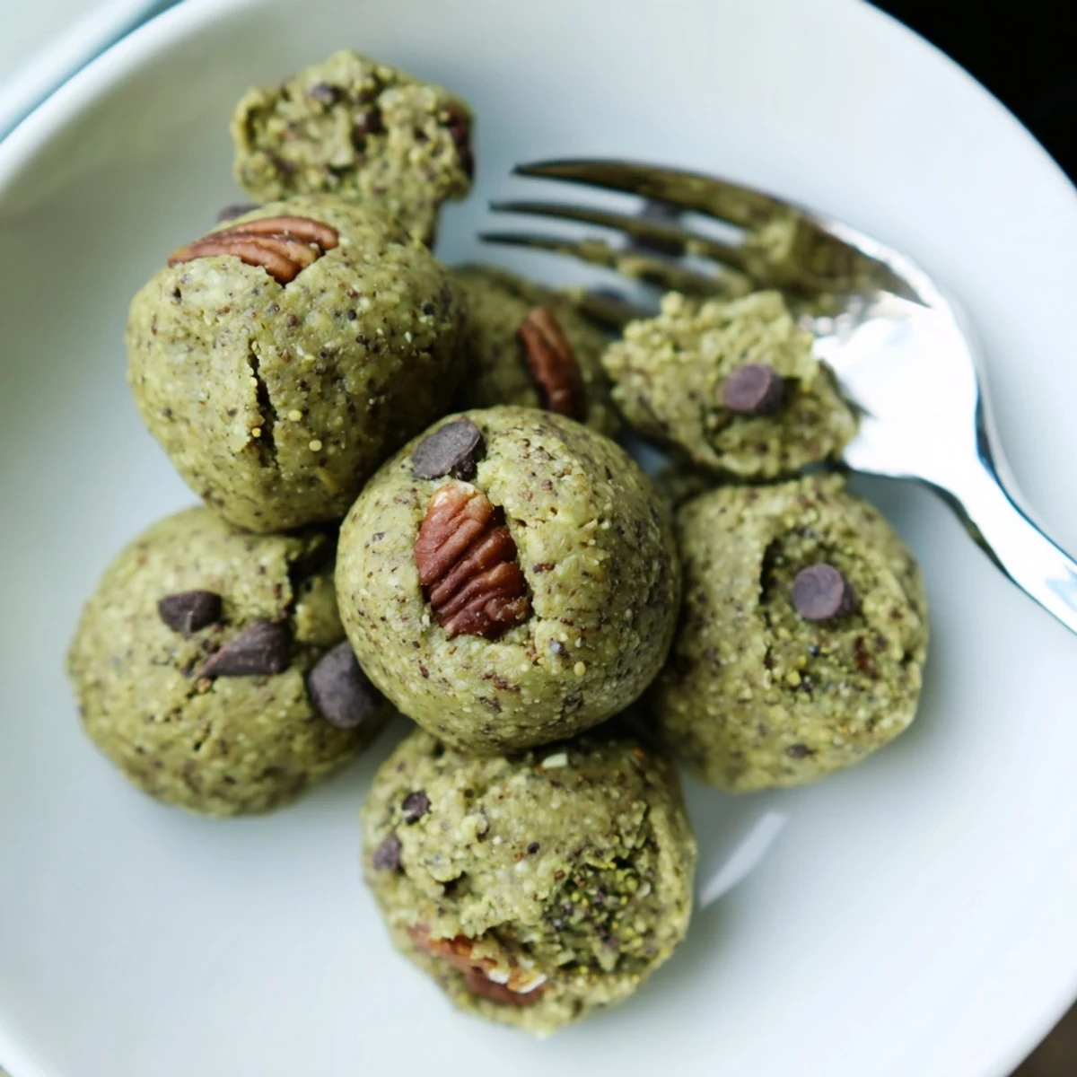 Matcha Gingerbread Cookie Dough Protein Bites, rolled into perfect spheres, ready to enjoy as a quick snack.