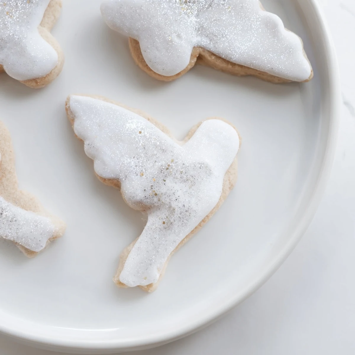 A close-up of buttery angel wings sugar cookies with colorful sprinkles, perfect for gifting this holiday.