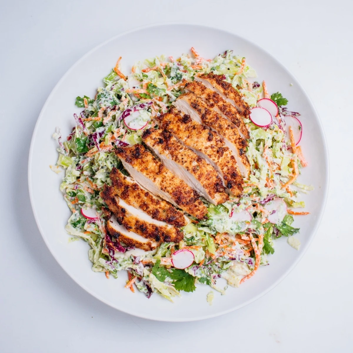 This Green Goddess Cabbage Slaw with Grilled Chicken features tender chicken and a bright, flavorful dressing.