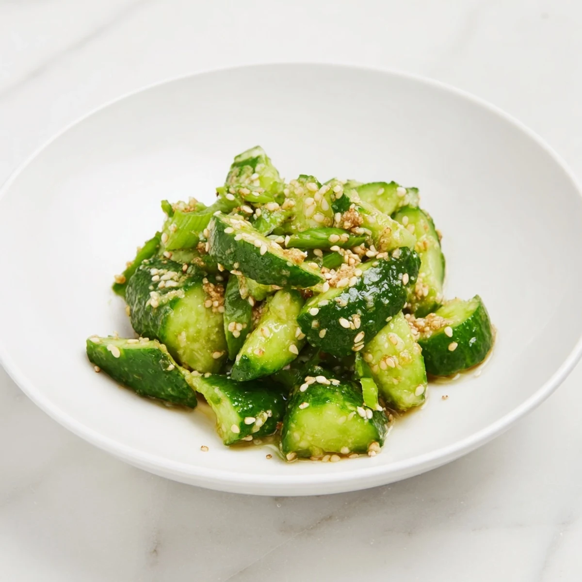 A close-up of a Cucumber Shaker, glistening with sesame oil and perfectly seasoned, ready to eat.