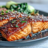 Miso glazed salmon fillet with vibrant, seared sesame bok choy for dinner.