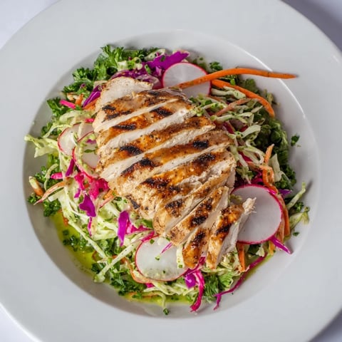 Green Goddess Cabbage Slaw with Grilled Chicken: Juicy chicken atop a vibrant, creamy slaw bursting with fresh herbs.