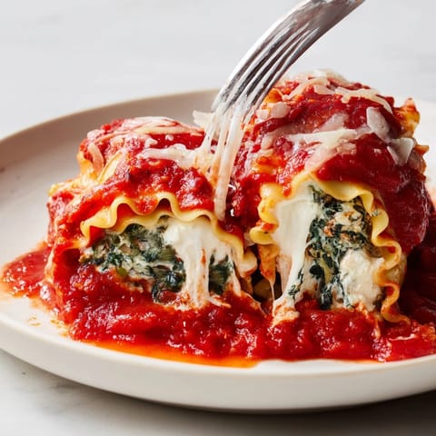 Cheesy Spinach Lasagna Roll-Ups bubbling, golden brown, fresh from the oven, dinner's ready!
