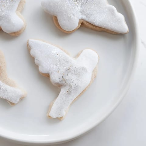 A close-up of buttery angel wings sugar cookies with colorful sprinkles, perfect for gifting this holiday.