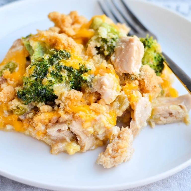 Delicious Chicken & Broccoli Cheddar Bake, a comforting casserole with melted cheese goodness.   