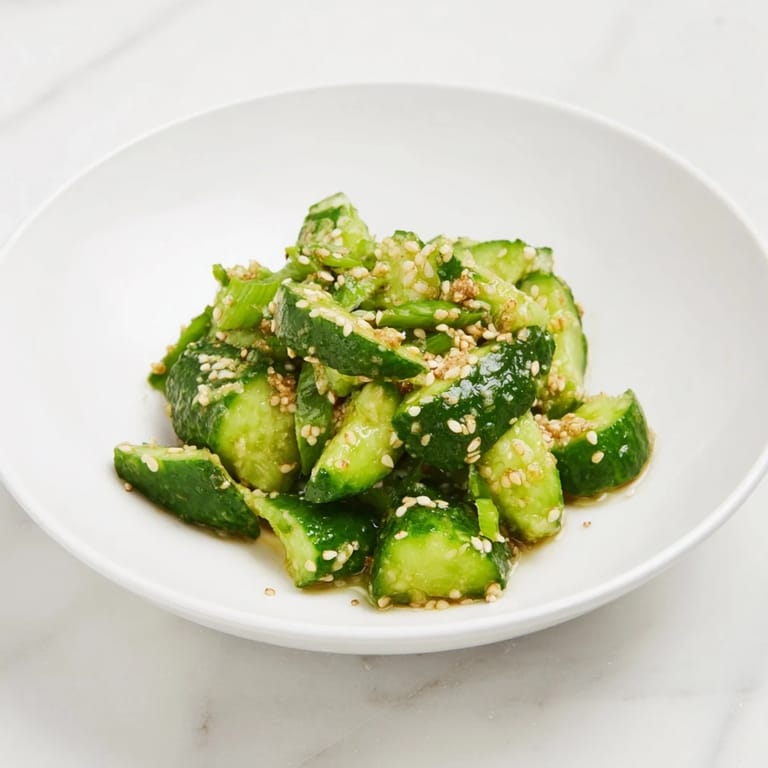 A close-up of a Cucumber Shaker, glistening with sesame oil and perfectly seasoned, ready to eat.